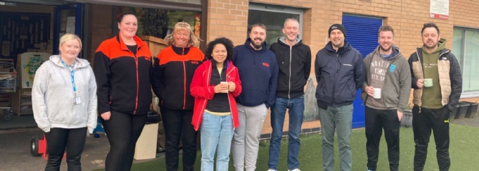 Photo of volunteers outside the academy